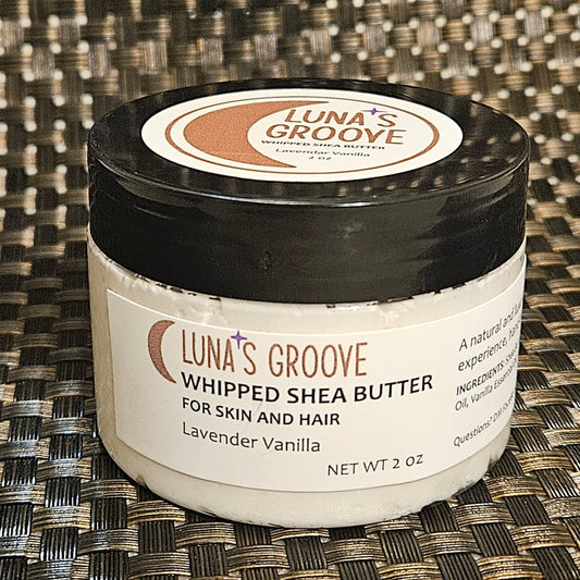 Jar of whipped shea butter with label on it.